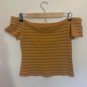 A short sleeve shirt with shoulder sleeves no tags but has only been worn twice